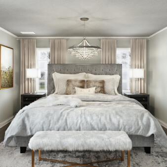 Modern bedroom decorated with earth tones and greys, including the walls and ceiling. Dark wood bed and night tables, with a modern chandelier hanging from the ceiling.